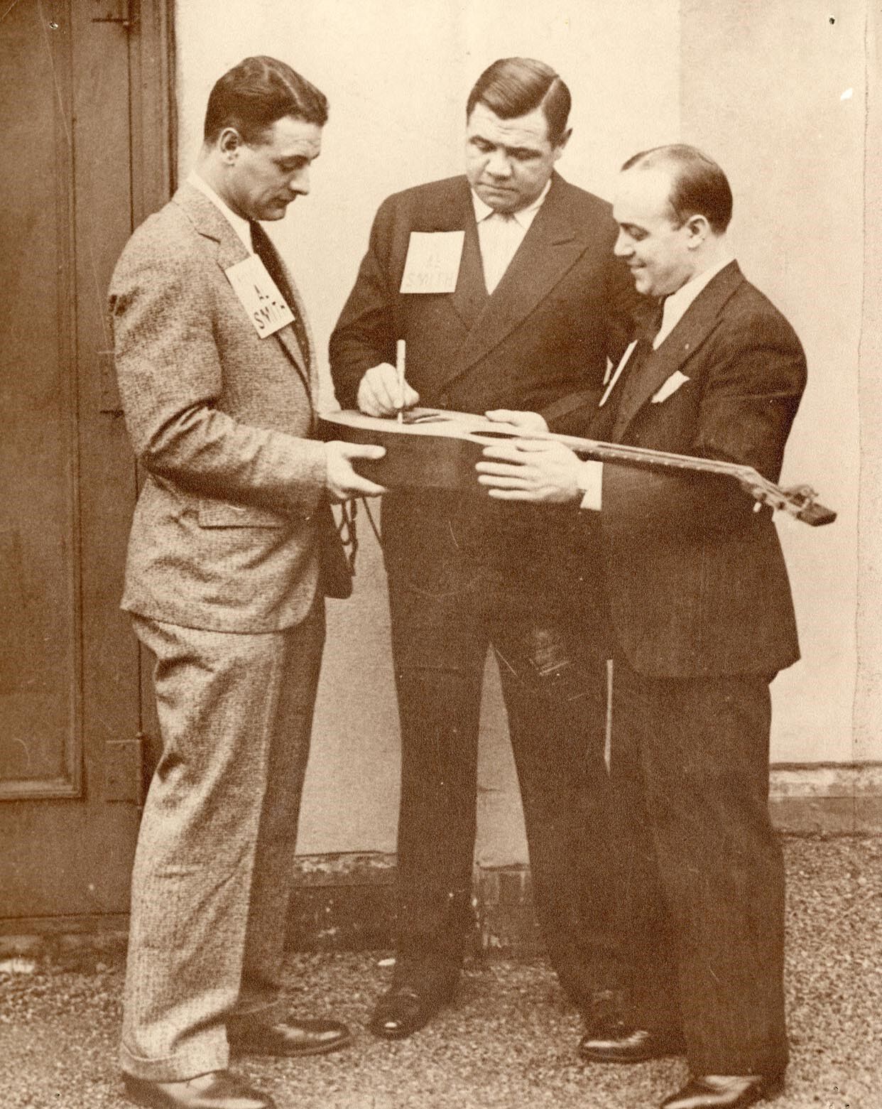 Babe Ruth signing the guitar